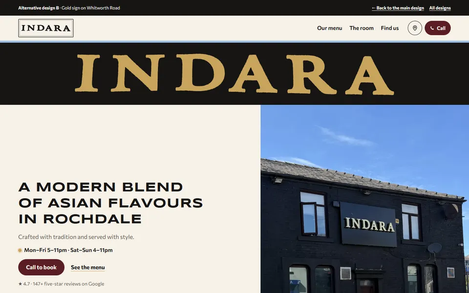 Alternative design B on a laptop: the INDARA letters across the top, the headline left and the shop front right